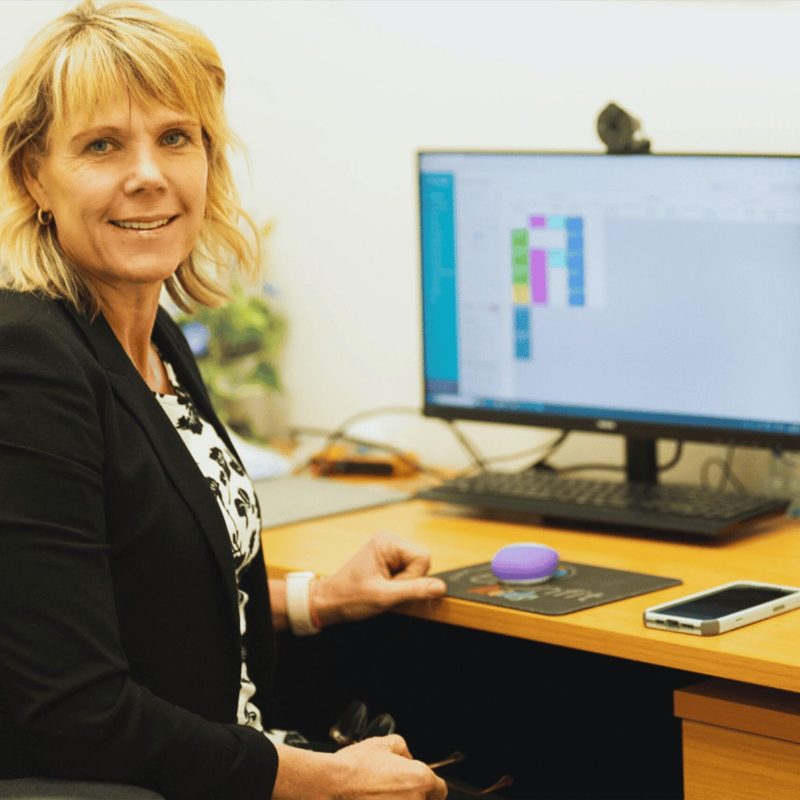 Dr-Michelle-About-Sitting at her desk